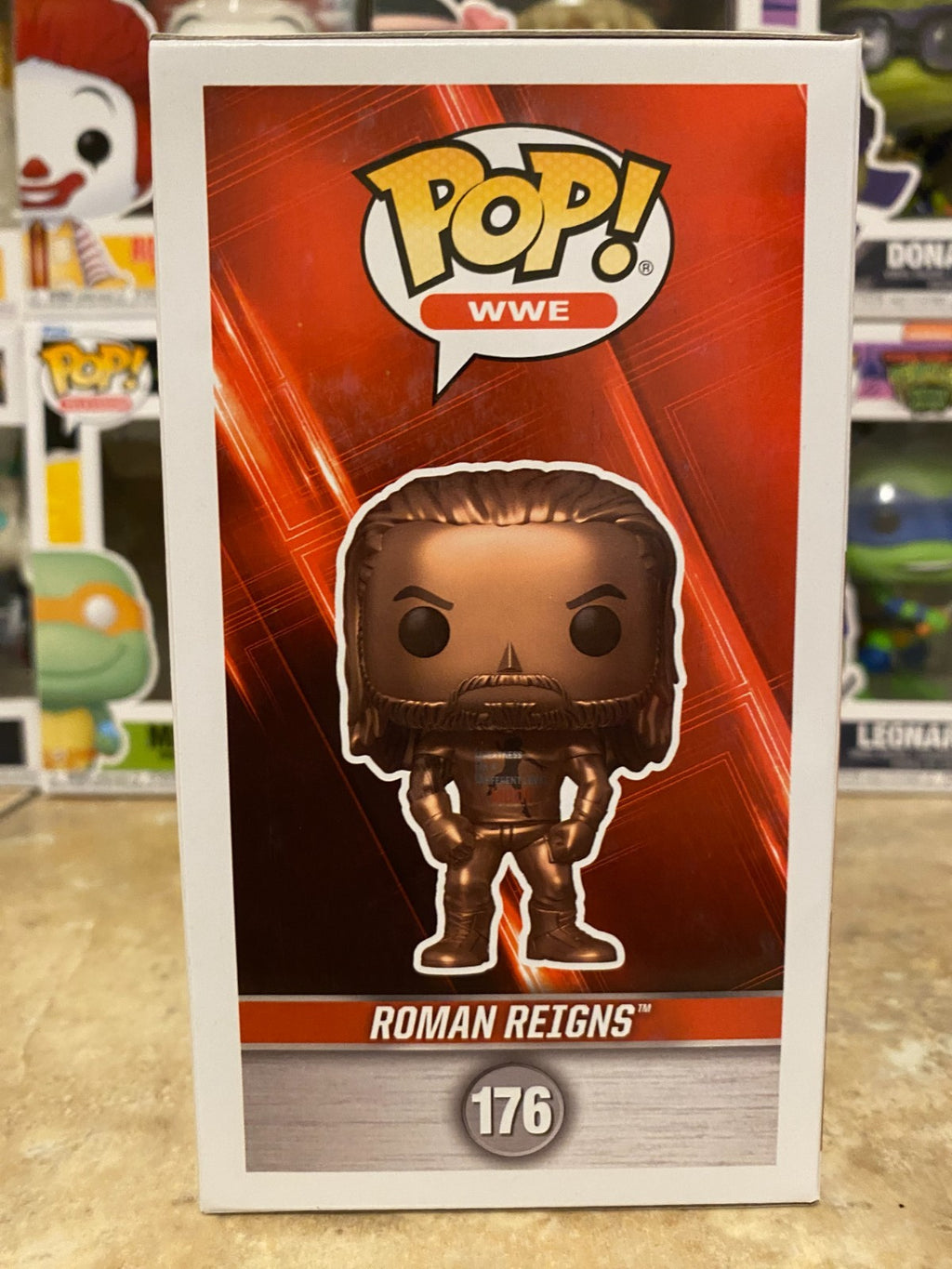 Funko Pop! WWE - Roman Reigns (Bronze) - Fanatics (Exclusive) #176 w Protector