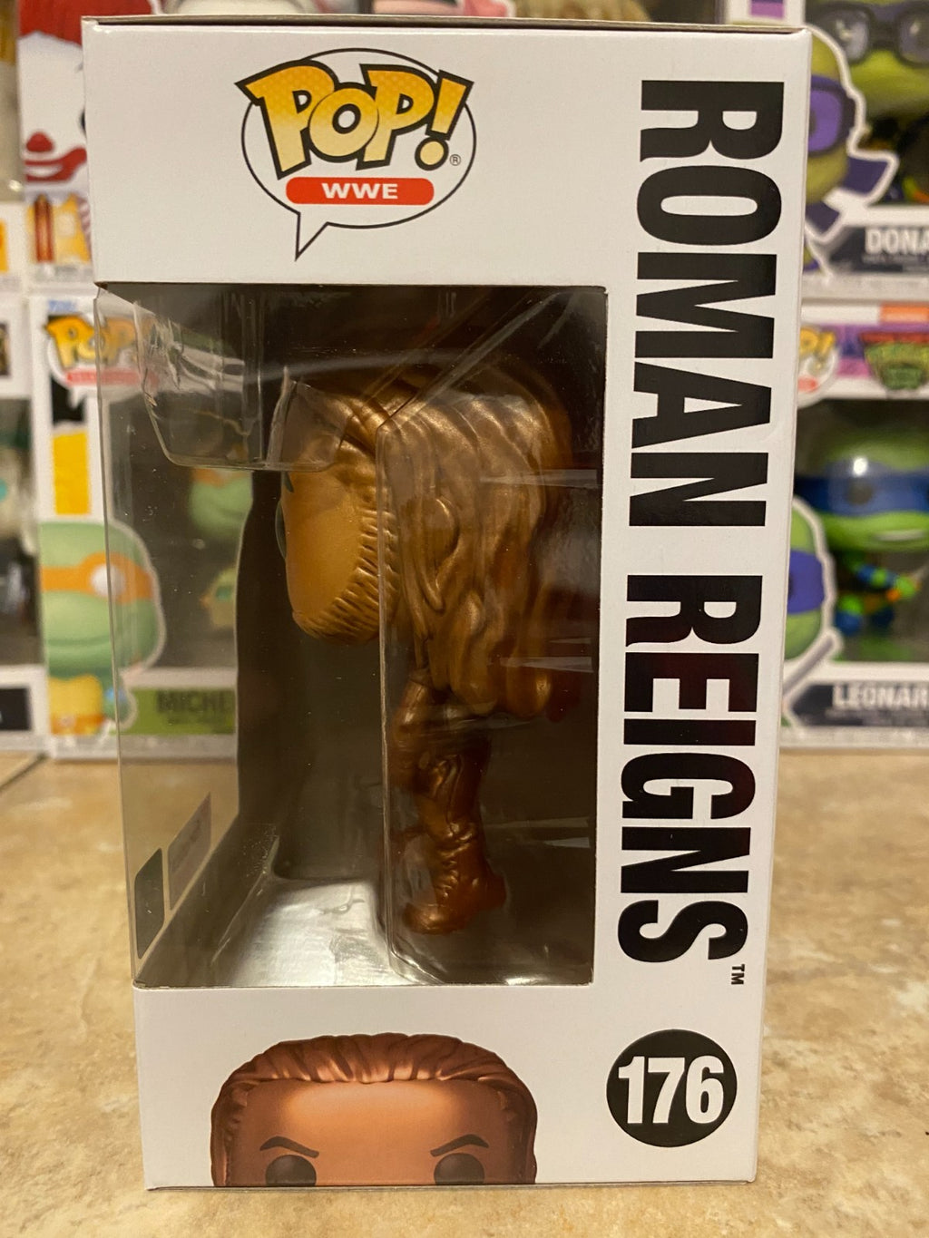 Funko Pop! WWE - Roman Reigns (Bronze) - Fanatics (Exclusive) #176 w Protector